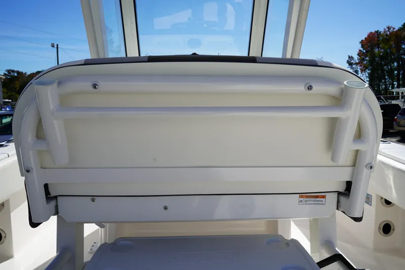 Slide: The Image of 2023 Robalo 266 Cayman boat seating with rod holders, showcasing sleek design and functionality. - 18