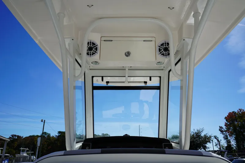 Slide: The Image of 2023 Robalo 266 Cayman boat interior with speakers and storage compartment. - 20