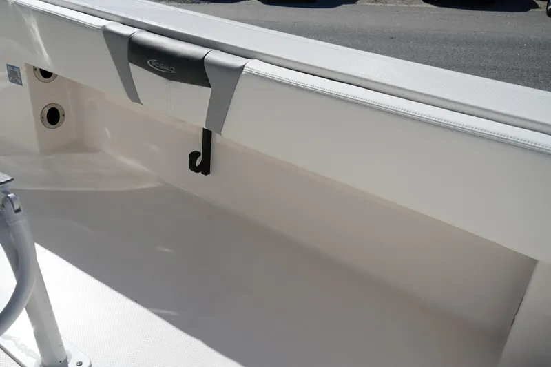 Slide: The Image of 2023 Robalo 266 Cayman boat interior detail with storage hook and clean design. - 22