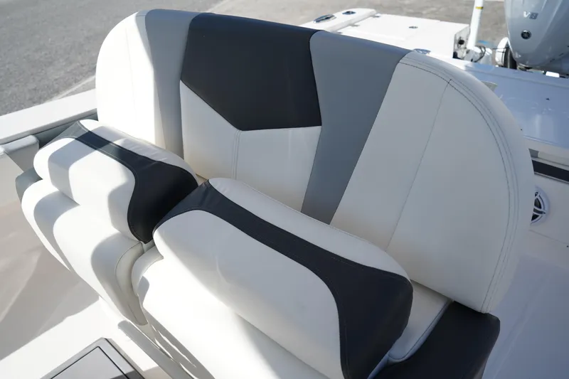 Slide: The Image of 2023 Robalo 266 Cayman boat seat with modern black and white design. - 25