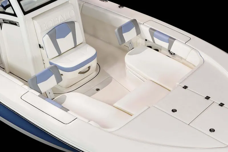 Slide: The Image of Manufacturer Provided Image: 2023 Robalo 266 Cayman boat interior with cushioned seating and storage compartments. - 30