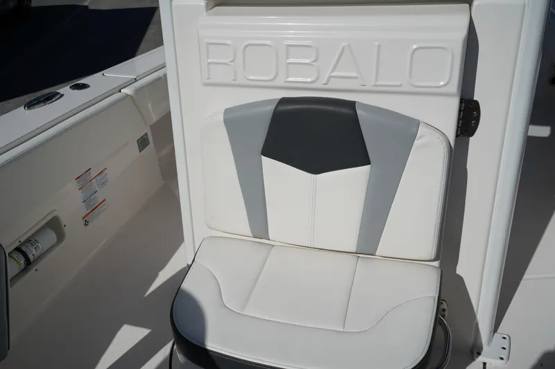 Slide: The Image of 2023 Robalo 266 Cayman boat seat with stylish gray and white upholstery. - 31