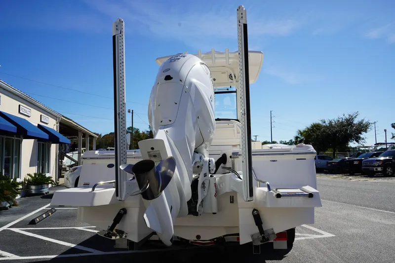 Slide: The Image of 2023 Robalo 266 Cayman boat rear view with powerful outboard motor. - 6