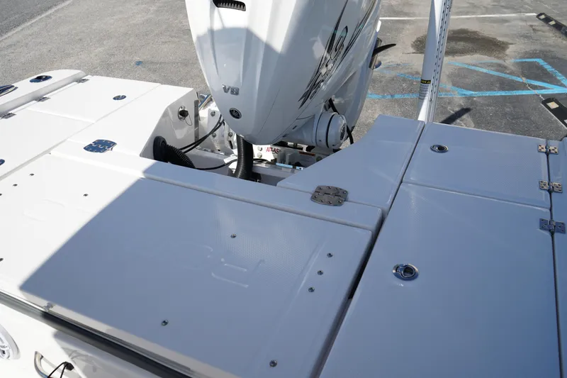 Slide: The Image of 2023 Robalo 266 Cayman boat with V8 engine, rear deck view. - 9