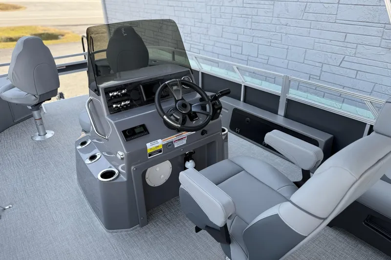 Slide: The Image of 2026 Avalon 2385 Venture 85 Center Fish boat interior with steering console and seating. - 11