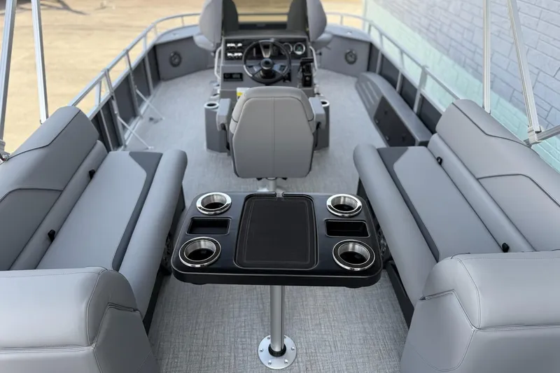 Slide: The Image of 2026 Avalon 2385 Venture 85 Center Fish pontoon boat interior with seating and table. - 16