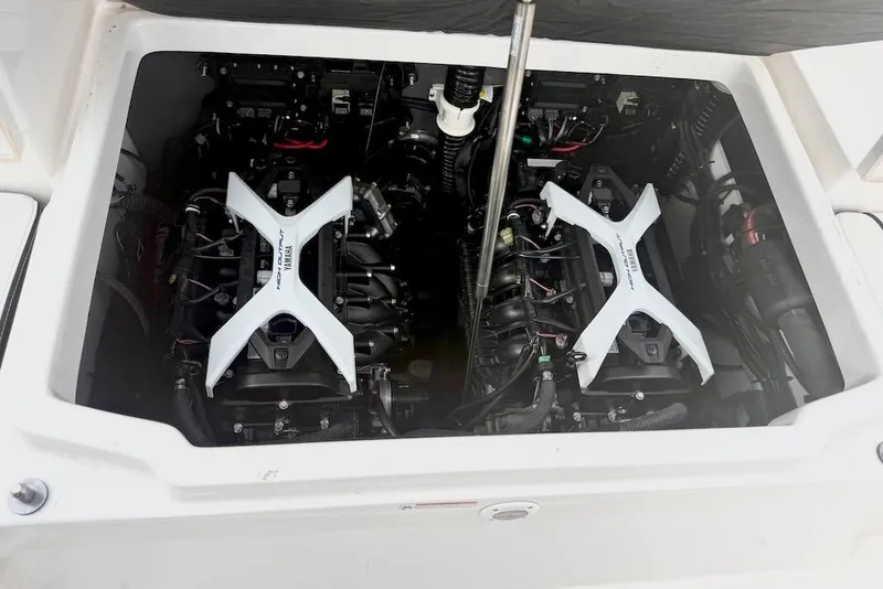 Slide: The Image of 2024 Yamaha Boats 222 FSH Sport E engine compartment with twin engines visible. - 19