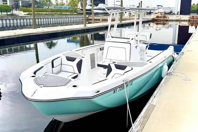 Slide: The Image of 2024 Yamaha Boats 222 FSH Sport E docked, showcasing sleek design and modern features. - 3