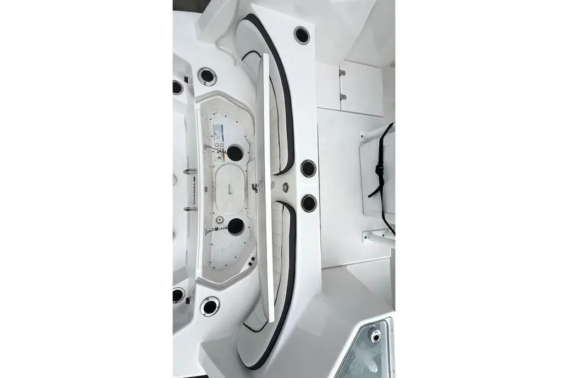 Slide: The Image of 2024 Yamaha Boats 222 FSH Sport E interior, showcasing sleek white design and functional layout. - 8