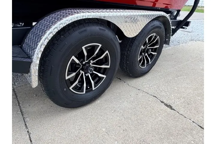 Slide: The Image of 2026 Crestliner 2050 Commander trailer with dual black alloy wheels and diamond plate fenders. - 13