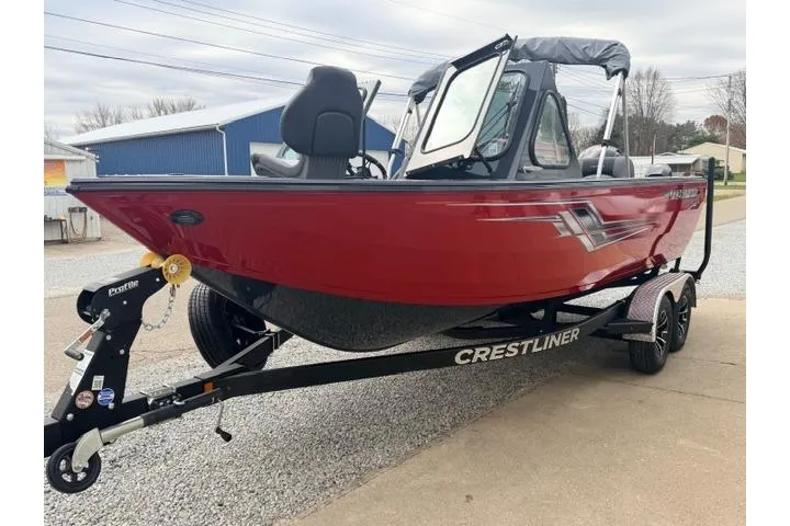 Slide: The Image of 2026 Crestliner 2050 Commander boat in red on a trailer, parked outdoors. - 8