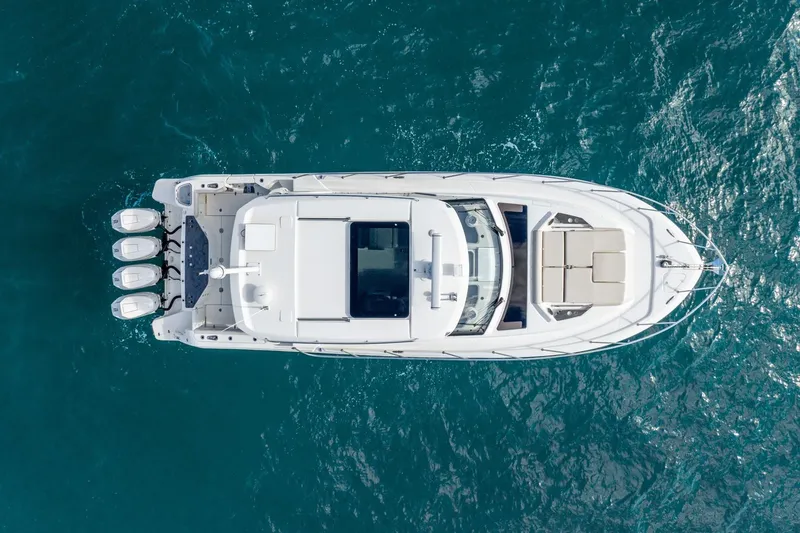 Slide: The Image of Aerial view of 2024 Boston Whaler 405 Conquest yacht on blue ocean water. - 10