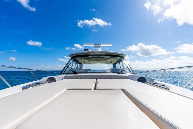 Slide: The Image of Boston Whaler 405 Conquest 2024 on open sea under blue sky. - 14