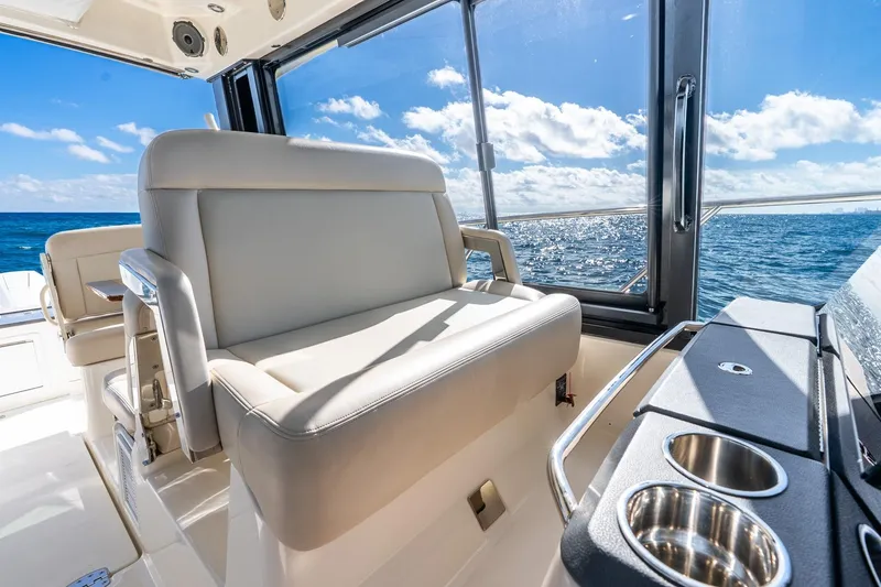 Slide: The Image of Luxurious interior of 2024 Boston Whaler 405 Conquest with ocean view and seating. - 20