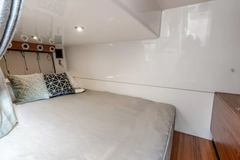 Slide: The Image of Luxurious cabin interior of 2024 Boston Whaler 405 Conquest with cozy bedding and modern design. - 37