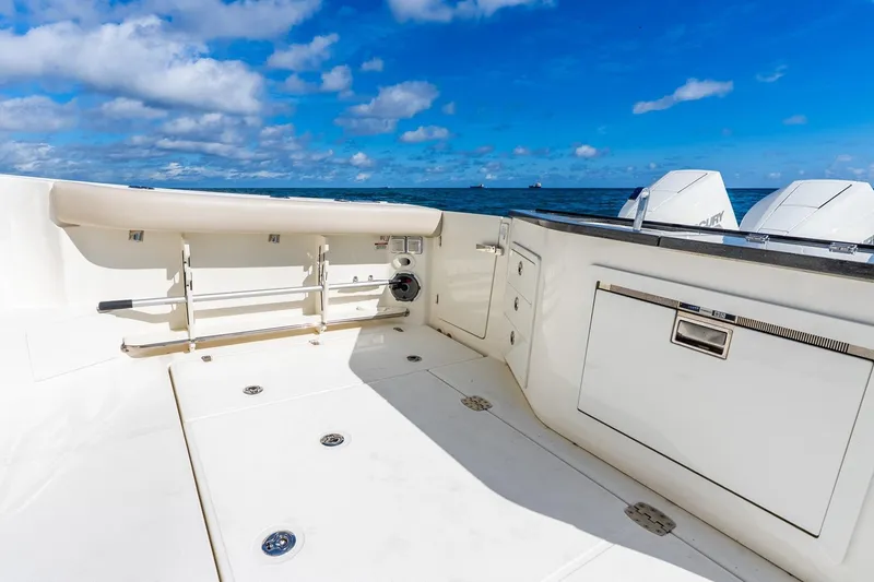 Slide: The Image of 2024 Boston Whaler 405 Conquest boat deck with ocean view and clear sky. - 40