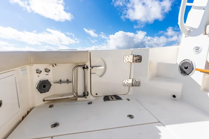 Slide: The Image of 2024 Boston Whaler 405 Conquest boat deck with blue sky background. - 41