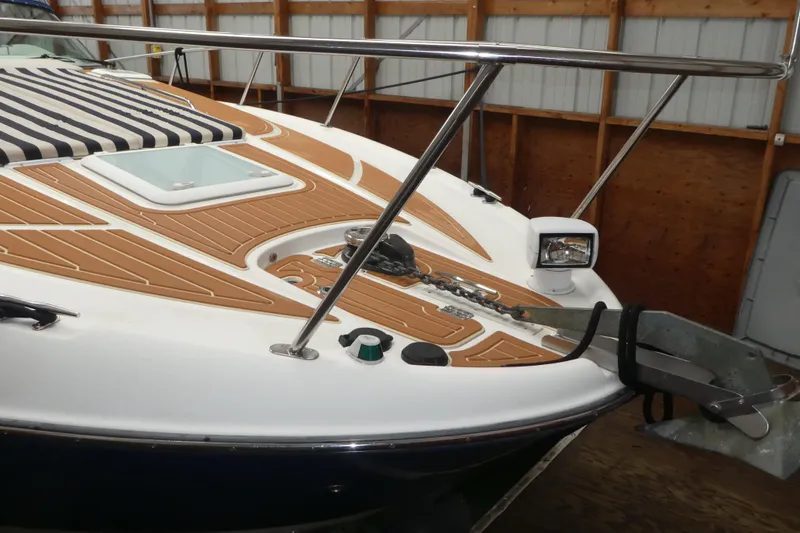 Slide: The Image of 2007 Bayliner 325 boat bow with anchor and teak deck in storage. - 3