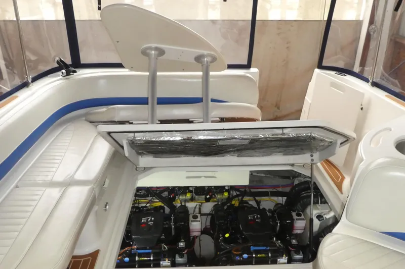 Slide: The Image of 2007 Bayliner 325 boat interior showing engine compartment and seating area. - 34