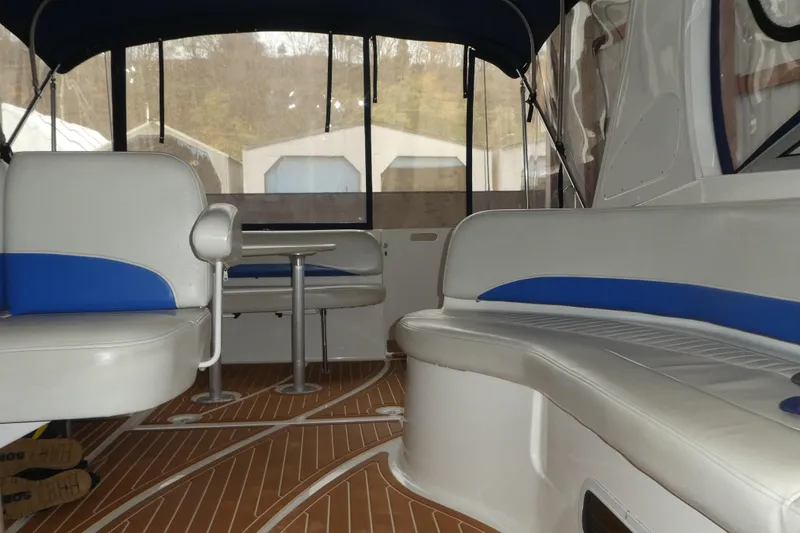 Slide: The Image of Interior of a 2007 Bayliner 325 boat with seating and table. - 35