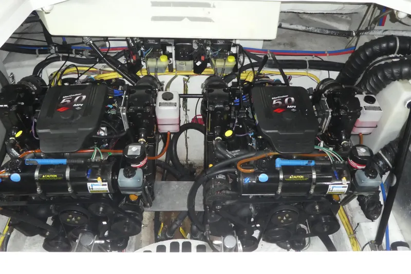 Slide: The Image of Engine compartment of a 2007 Bayliner 325 boat with dual MerCruiser 5.0 MPI engines. - 36