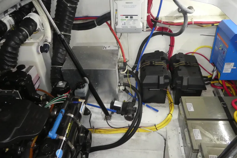 Slide: The Image of Engine room of a 2007 Bayliner 325 with batteries and wiring. - 37