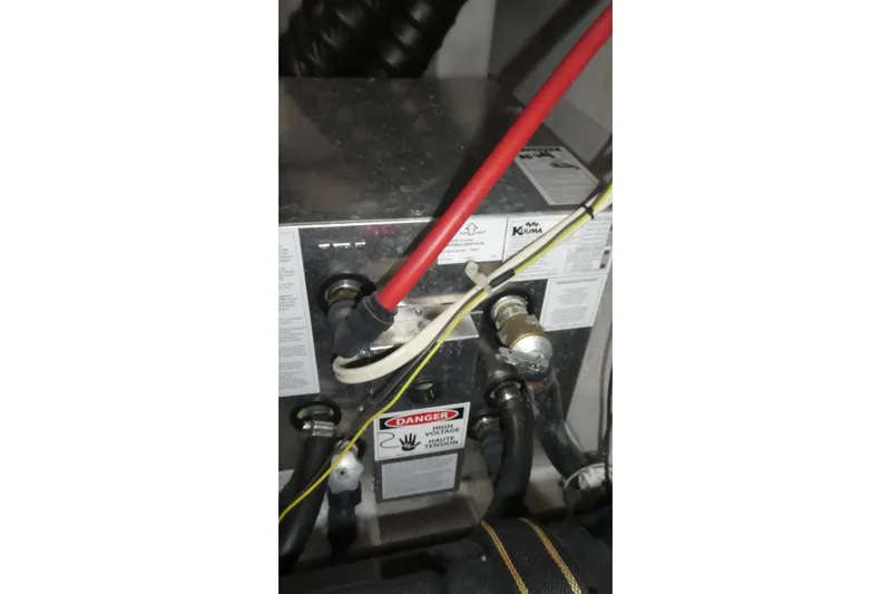 Slide: The Image of Engine compartment of a 2007 Bayliner 325 boat, featuring wiring and components. - 42