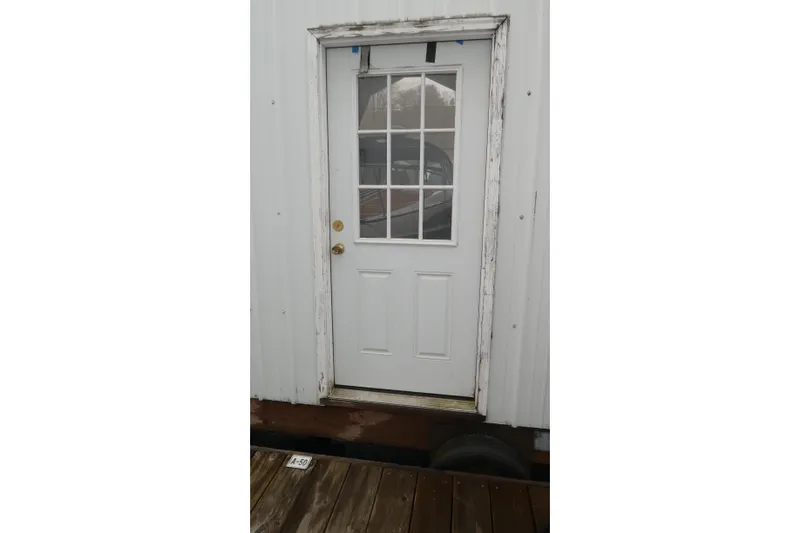 Slide: The Image of White door with window panels on a Bayliner 325 boat, 2007 model. - 44