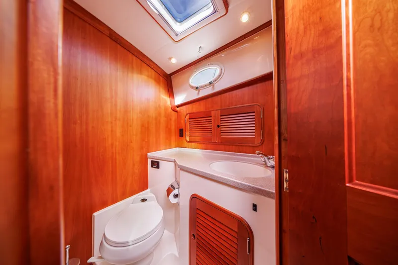 Slide: The Image of Luxurious wooden bathroom interior of 1999 Hinckley Talaria 44 Express yacht. - 42