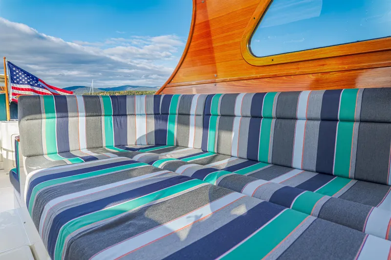 Slide: The Image of Striped seating on 1999 Hinckley Talaria 44 Express yacht with American flag. - 22