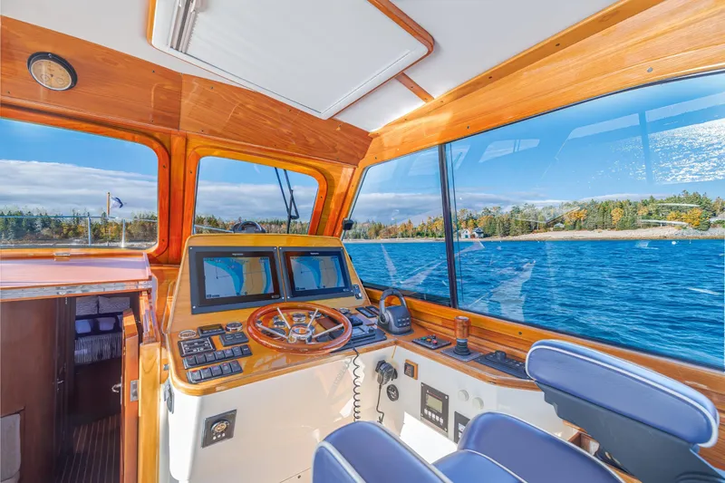 Slide: The Image of Interior of 1999 Hinckley Talaria 44 Express yacht with scenic water view. - 25