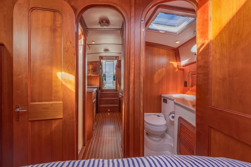 Slide: The Image of Interior of 1999 Hinckley Talaria 44 Express yacht with wooden finish and bathroom. - 41