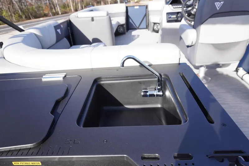 Slide: The Image of 2026 Viaggio Lago V-R boat interior with sink and seating area. - 18