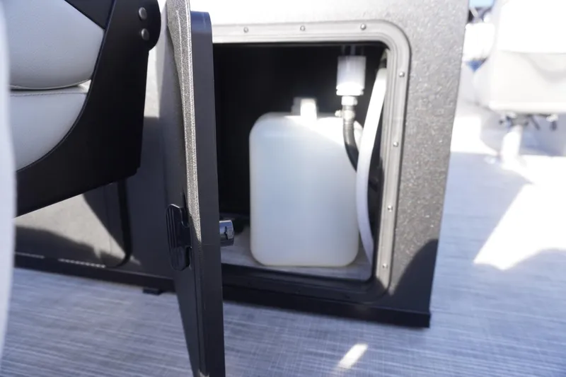 Slide: The Image of Storage compartment in 2026 Viaggio Lago V-R boat with a white container inside. - 27