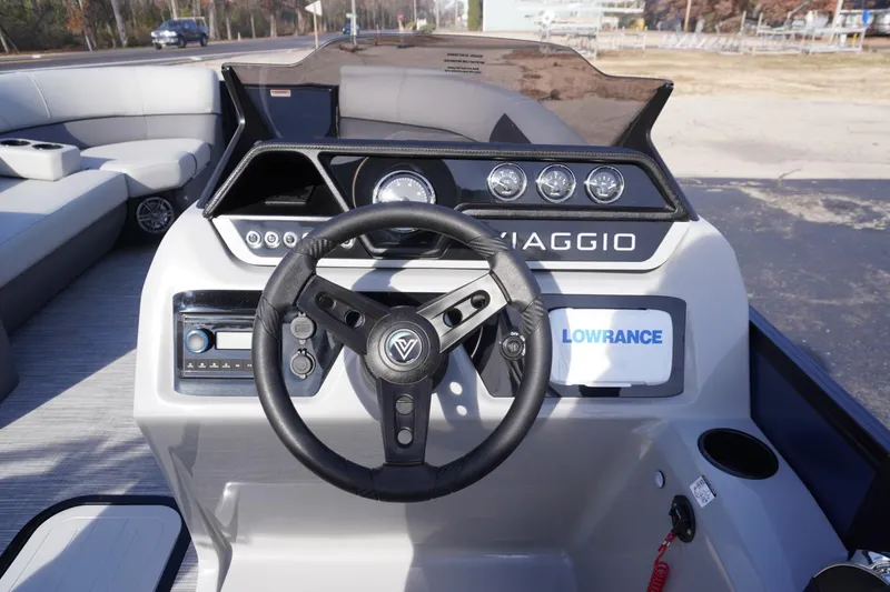 Slide: The Image of Steering console of 2026 Viaggio Lago V-R boat with modern controls and Lowrance display. - 34