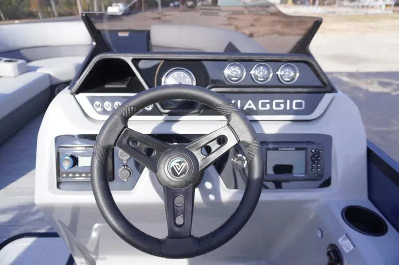 Slide: The Image of Steering console of 2026 Viaggio Lago V-R boat with modern controls and dashboard. - 35