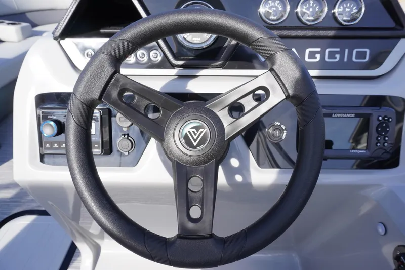Slide: The Image of Steering wheel of 2026 Viaggio Lago V-R boat with dashboard controls. - 38