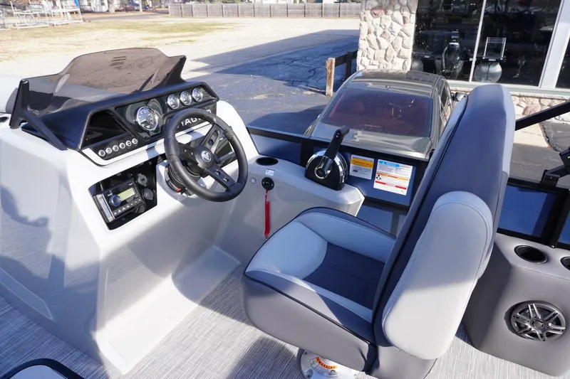 Slide: The Image of 2026 Viaggio Lago V-R boat cockpit with steering wheel and control panel. - 44