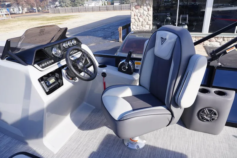 Slide: The Image of Captain's seat and helm of 2026 Viaggio Lago V-R boat, featuring modern controls and design. - 45