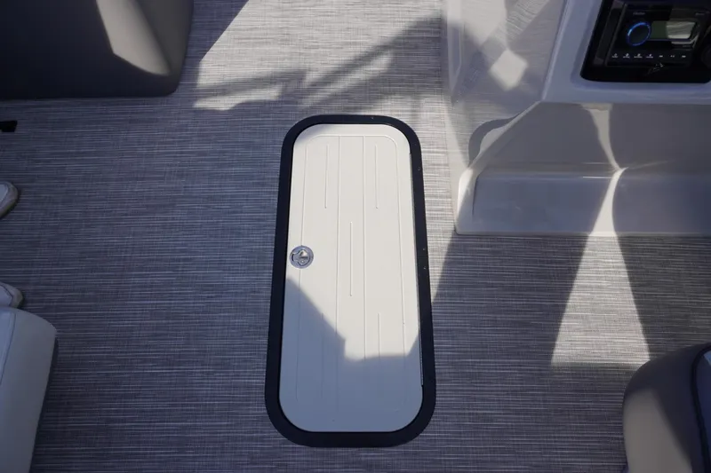 Slide: The Image of 2026 Viaggio Lago V-R boat deck with storage hatch and modern interior design. - 46