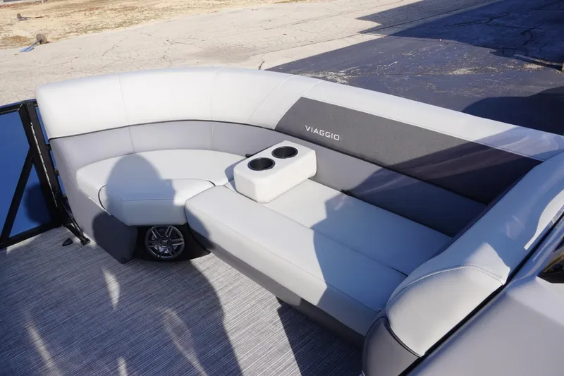 Slide: The Image of 2026 Viaggio Lago V-R boat interior with gray seating and cup holders. - 49
