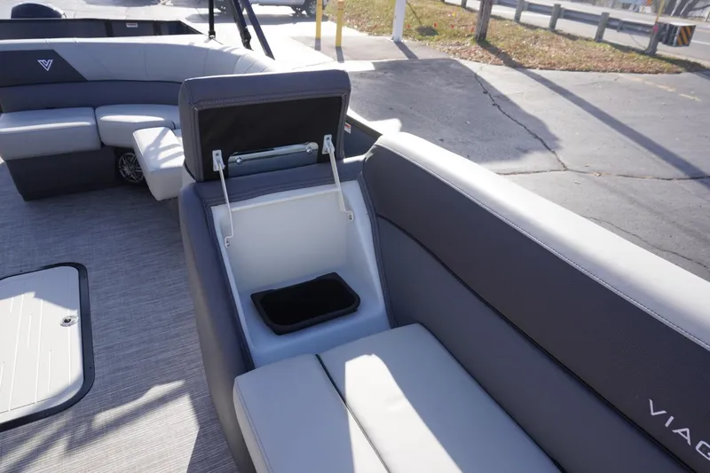 Slide: The Image of 2026 Viaggio Lago V-R boat interior with open storage compartment and sleek seating design. - 56