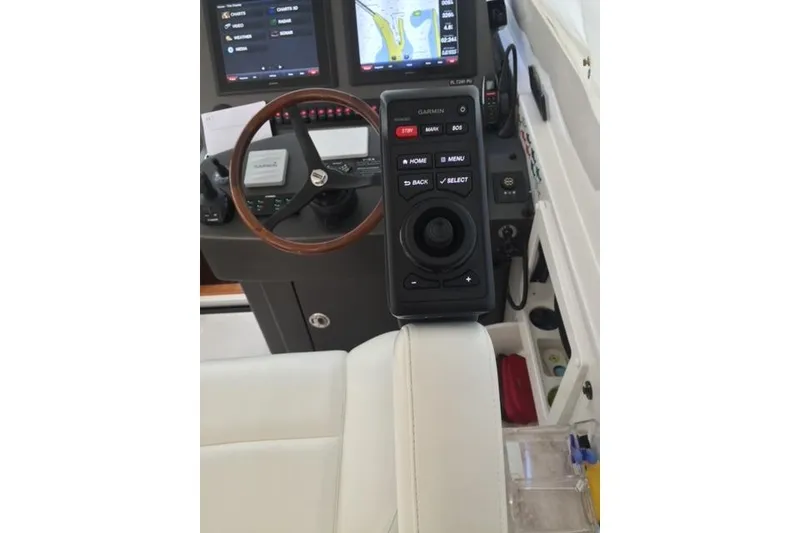 Slide: The Image of Control panel of a 2015 Jupiter 41 SB boat with Garmin navigation system. - 20