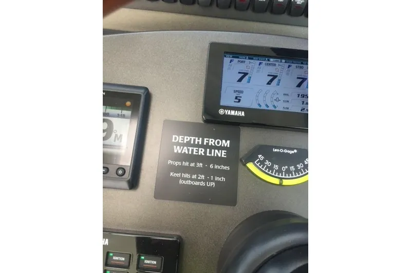 Slide: The Image of Control panel of 2015 Jupiter 41 SB boat with depth and speed gauges. - 22