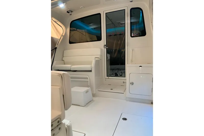 Slide: The Image of Interior of 2015 Jupiter 41 SB boat with white seating and modern design. - 25