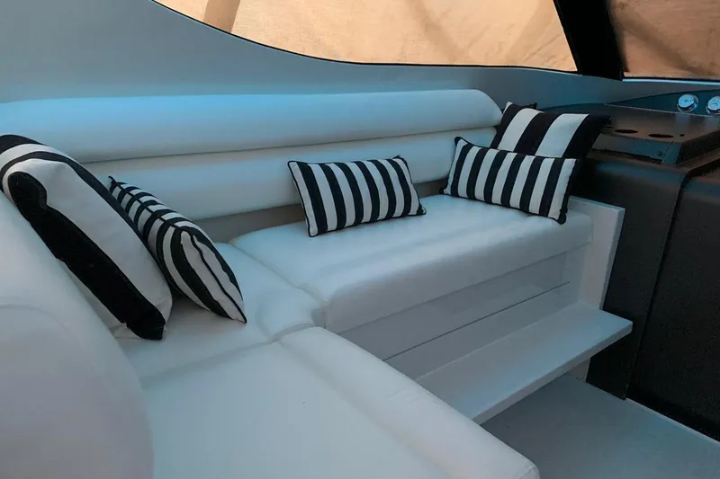 Slide: The Image of Luxurious interior of 2015 Jupiter 41 SB yacht with striped cushions and white seating. - 29