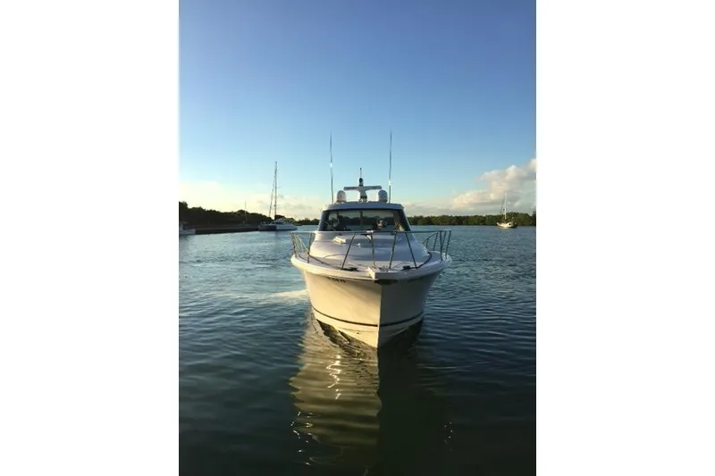 Slide: The Image of 2015 Jupiter 41 SB boat on calm water at sunset. - 4