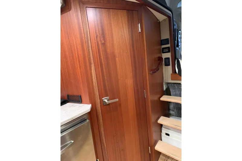 Slide: The Image of Interior of 2015 Jupiter 41 SB yacht with wooden door and staircase. - 40