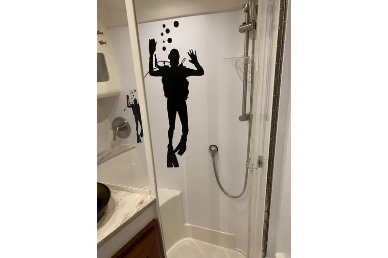 Slide: The Image of Shower area in 2015 Jupiter 41 SB boat with diver silhouette decor. - 41
