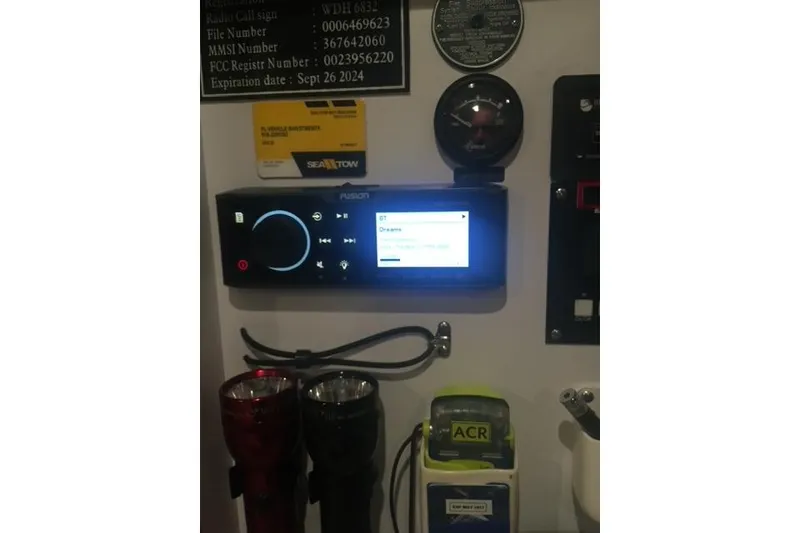 Slide: The Image of Control panel of a 2015 Jupiter 41 SB boat with various instruments and devices. - 48
